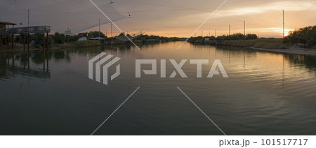 Wonderful view of fishing huts at sunset near Ravenna 101517717