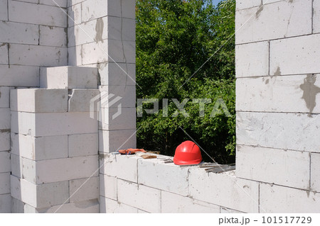 Construction site of a house under construction from white gas blocks. Building a house on the site 101517729
