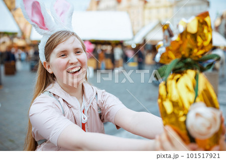 smiling modern child in pink jacket at fair in city 101517921
