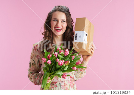 smiling stylish woman with long wavy brunette hair on pink smiling stylish woman with long wavy brunette hair on pink 101519324