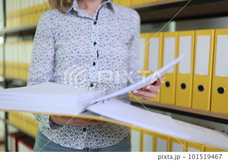 Accountant looks for documents running through files 101519467