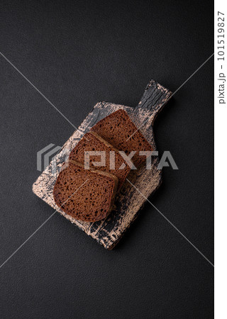 Loaf of fresh crispy brown bread with grains and seeds Loaf of fresh crispy brown bread with grains and seeds 101519827
