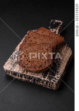 Loaf of fresh crispy brown bread with grains and seeds 101519829