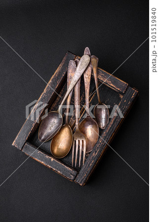 Vintage rectangular shabby wooden box with spoons and forks Vintage rectangular shabby wooden box with spoons and forks 101519840
