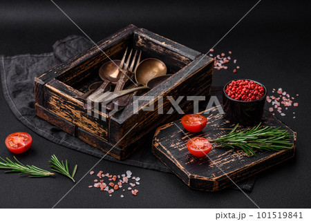 Vintage rectangular shabby wooden box with spoons and forks Vintage rectangular shabby wooden box with spoons and forks 101519841