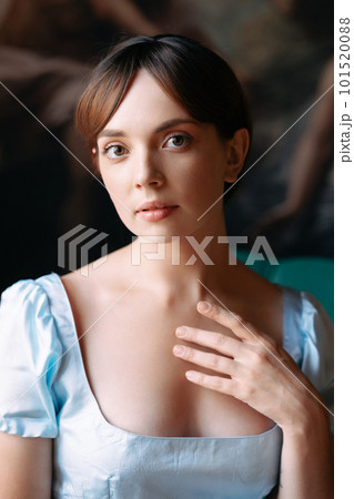 Portrait of a young beautiful girl in a blue Regency style dress Portrait of a young beautiful girl in a blue Regency style dress 101520088