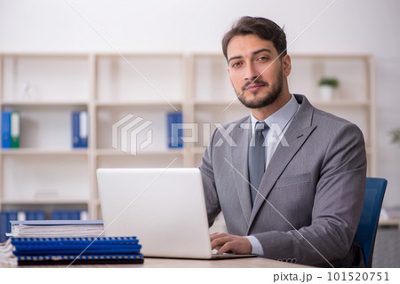 Young male employee working in the office 101520751