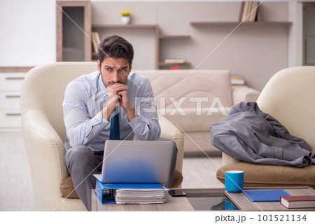 Young male employee working from home Young male employee working from home 101521134