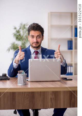Young male employee working in the office 101522410