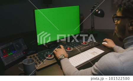 African American film maker works on computer 101522580