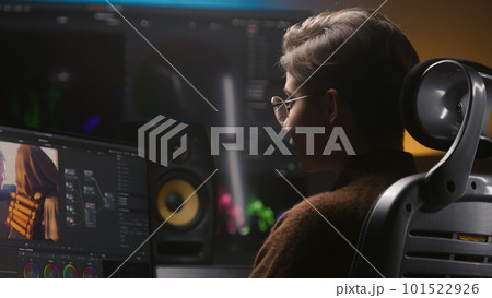 Young editor makes color grading for film post production Young editor makes color grading for film post production 101522926