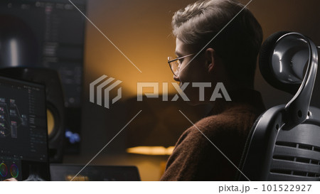Young woman edits photo or develops design on PC Young woman edits photo or develops design on PC 101522927