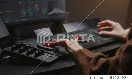 Female editor uses digital color correction control surfaces Female editor uses digital color correction control surfaces 101522928