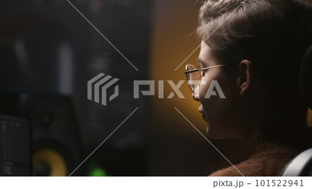 Young woman edits photo or develops design on PC 101522941