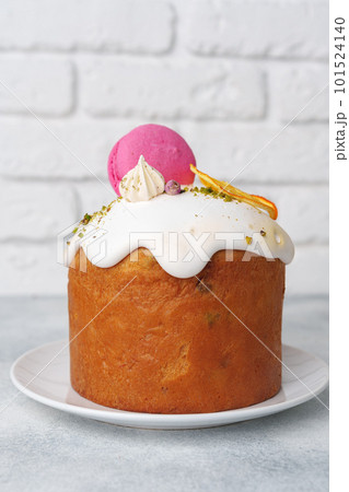Beautiful Easter cake decorated with macarons cookie and dry orange piece Beautiful Easter cake decorated with macarons cookie and dry orange piece 101524140