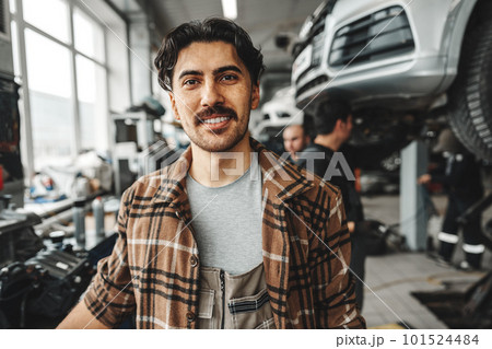 Portrait of a male mechanic in an auto repair shop Portrait of a male mechanic in an auto repair shop 101524484