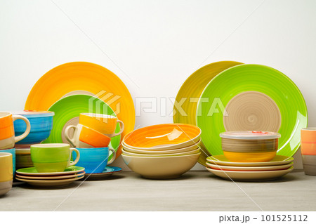 Set of colored ceramic dishware front view 101525112