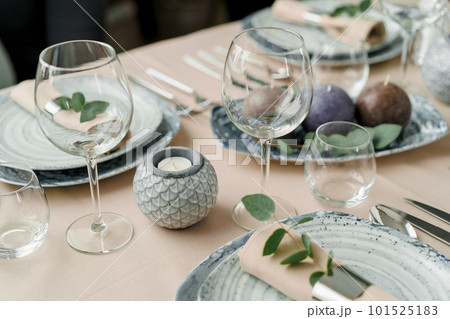 Luxury table setting for dining in pastel colors close up 101525183