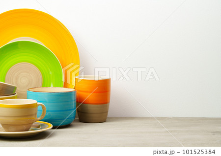 Set of colored ceramic dishware front view Set of colored ceramic dishware front view 101525384