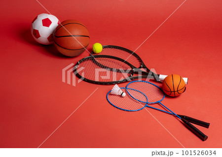 Sport equipment flat lay. Variety of rackets and balls 101526034