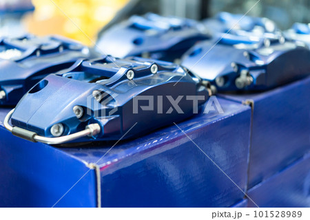 Checking car brake system for repair at car garage Checking car brake system for repair at car garage 101528989