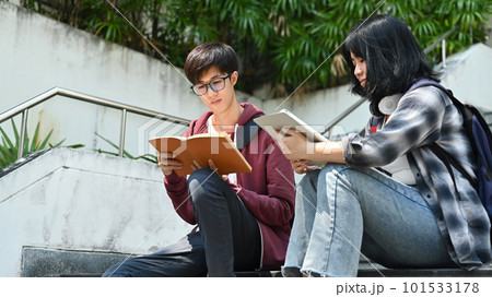 Group of students are working on academic project or preparing for exam together. Education, Learning and technology concept 101533178
