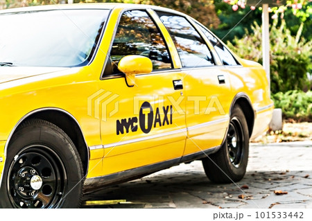 Details of yellow taxi close-up wheel, door 101533442