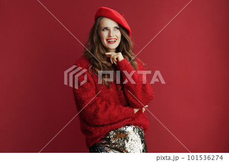 smiling modern woman in red sweater and beret smiling modern woman in red sweater and beret 101536274