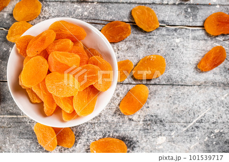Fragrant dried apricots in a bowl on the table. Fragrant dried apricots in a bowl on the table. 101539717