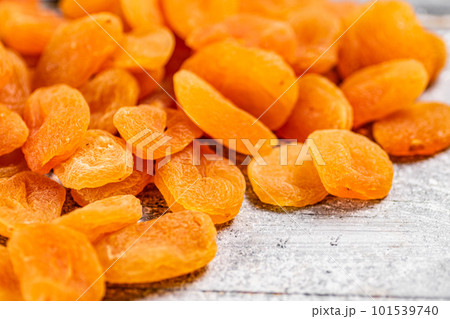 A pile of delicious dried apricots on the table. 101539740
