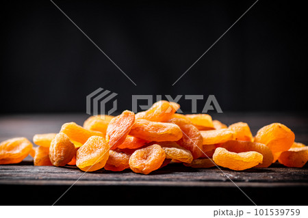 A bunch of dried apricots on the table. A bunch of dried apricots on the table. 101539759