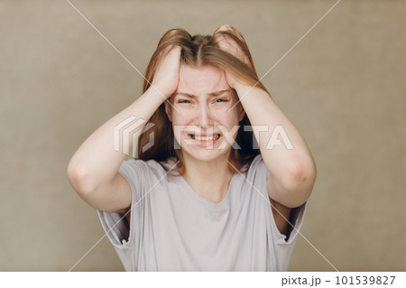 Portrait of young caucasian actress crying upset woman against beige background. Acting test Casting film movie acting auditions. 101539827