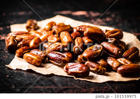 A pile of dates on paper on the table. A pile of dates on paper on the table. 101539975