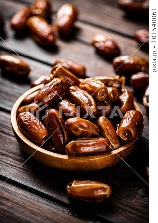 Ripe dates on a plate. 101540061