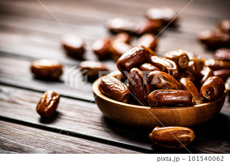 Ripe dates on a plate. 101540062