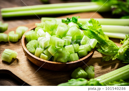 Sliced fresh celery on a cutting board. 101540286