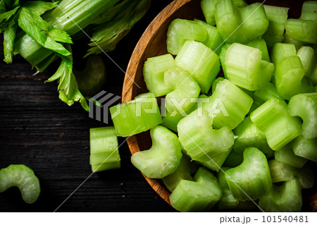 Sliced fresh celery. On a dark wooden background. Sliced fresh celery. On a dark wooden background. 101540481