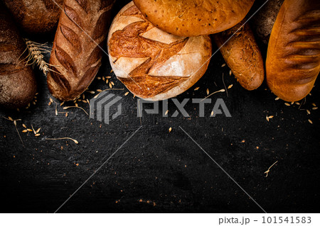 Different types of fresh bread on the table. 101541583