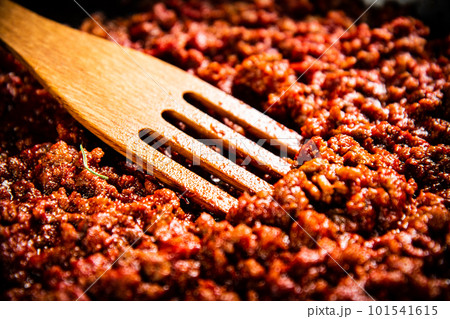 Bolognese sauce. Macro background. The texture of the Bolognese sauce. Bolognese sauce. Macro background. The texture of the Bolognese sauce. 101541615