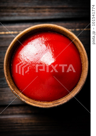 Tomato sauce in a bowl on the table. Tomato sauce in a bowl on the table. 101541774