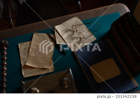 Vintage letters, glasses, pen and inkwell on a wooden table Vintage letters, glasses, pen and inkwell on a wooden table 101542239