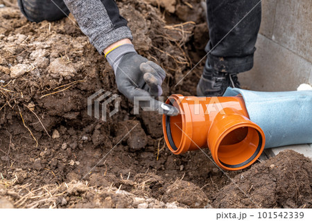 plastic pvc waste sewer pipe in the ground. construction site plastic pvc waste sewer pipe in the ground. construction site 101542339