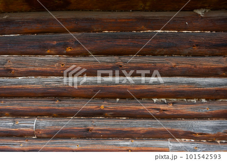 Wooden wall assembled of beams or logs. Log wall 101542593
