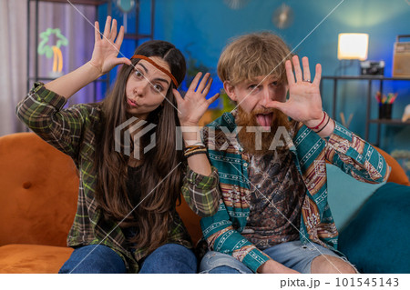 Family marriage couple man woman making silly facial expressions, fooling around showing tongue Family marriage couple man woman making silly facial expressions, fooling around showing tongue 101545143