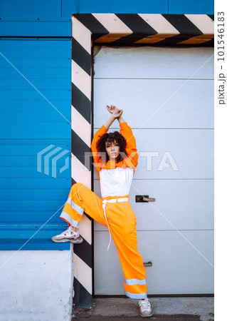 African American woman - dancer dancing in the street at sunset. Sport, dancing and urban culture concept. Fashion lifestyle. African American woman - dancer dancing in the street at sunset. Sport, dancing and urban culture concept. Fashion lifestyle. 101546183