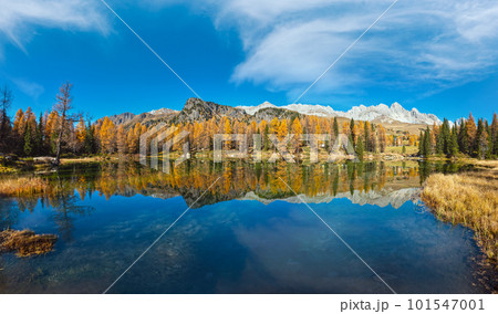 Autumn alpine mountain lake near San Pellegrino Pass, Trentino, Dolomites Alps, Italy. 101547001