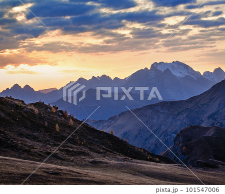 Mountain evening dusk peaceful hazy view from Giau Pass. Mountain evening dusk peaceful hazy view from Giau Pass. 101547006