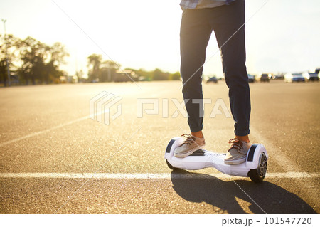 Young man riding on the Hoverboard in the park. content technologies. a new movement. Self Balancing Electric. Young man riding on the Hoverboard in the park. content technologies. a new movement. Self Balancing Electric. 101547720