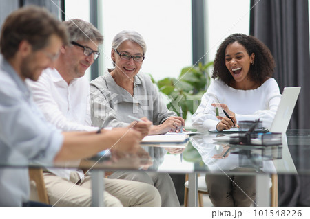 Conversation between managers and employees in the office at the table 101548226