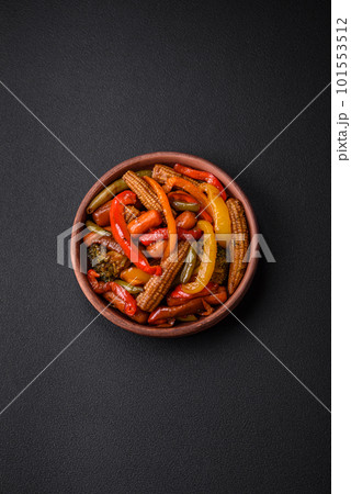 Mix of vegetables corn, carrots, peppers, broccoli, onions in teriyaki sauce 101553512